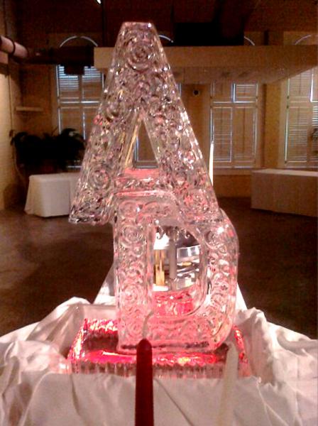 Hand carved letters with a red light steals the show from Louisville Ice Sculptures. Price $275